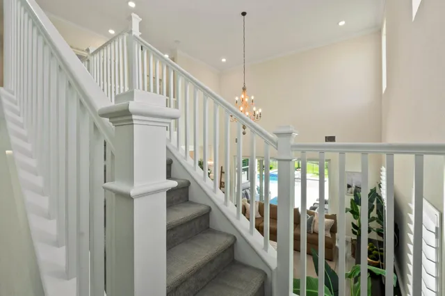 a spacious bathroom with a tub sink and mirror