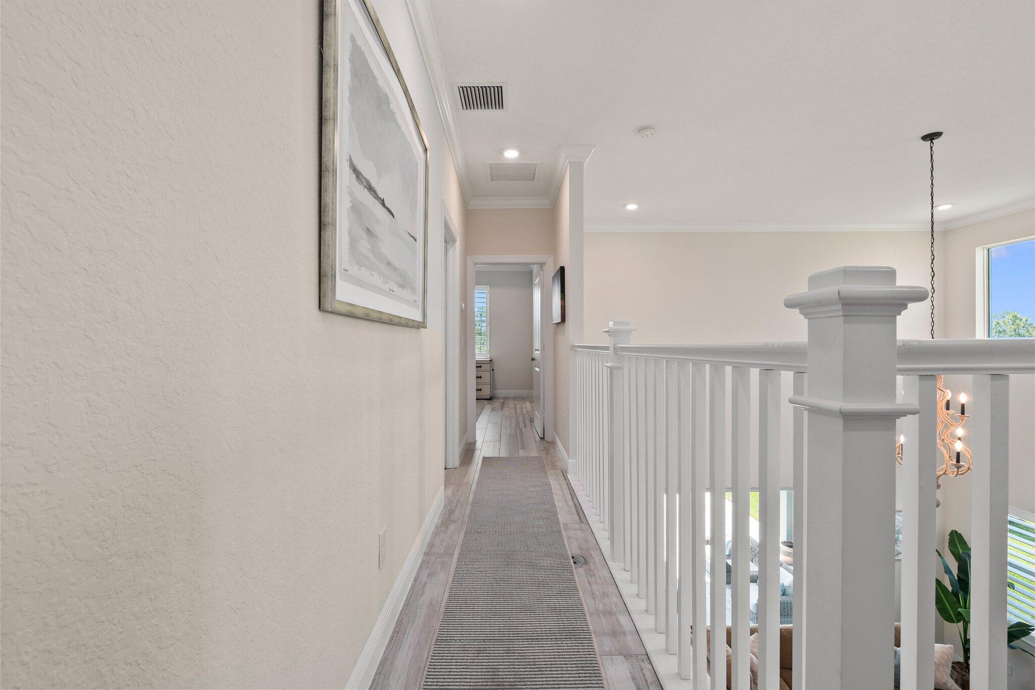 4701 Southwest Ardsley Drive Stuart, FL 34997 - Photo 29 of 83 a view of a hallway with wooden floor