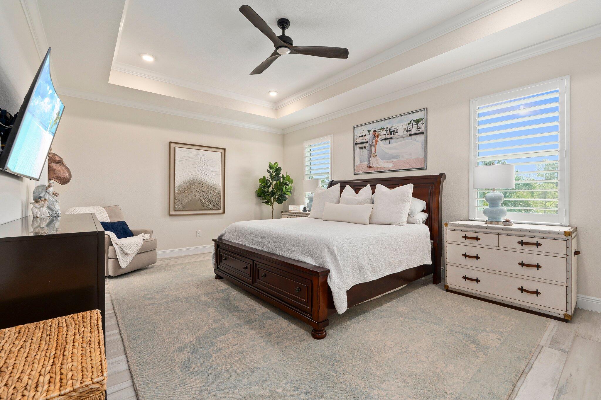 4701 Southwest Ardsley Drive Stuart, FL 34997 - Photo 31 of 83 a bedroom with a bed and window