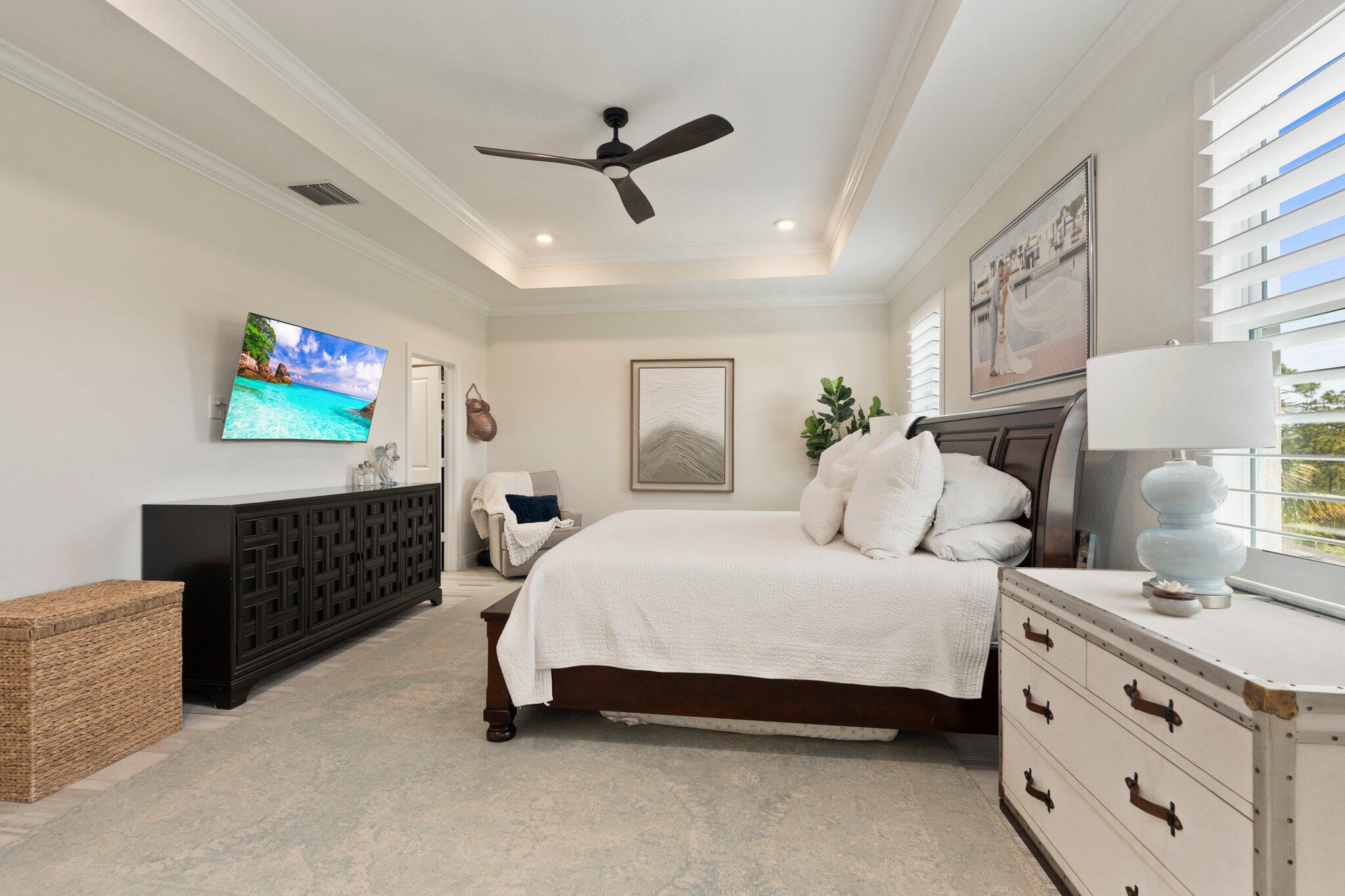 4701 Southwest Ardsley Drive Stuart, FL 34997 - Photo 34 of 83 a bedroom with a bed and furniture