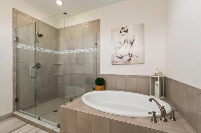 an aerial view of a house with swimming pool and lake view