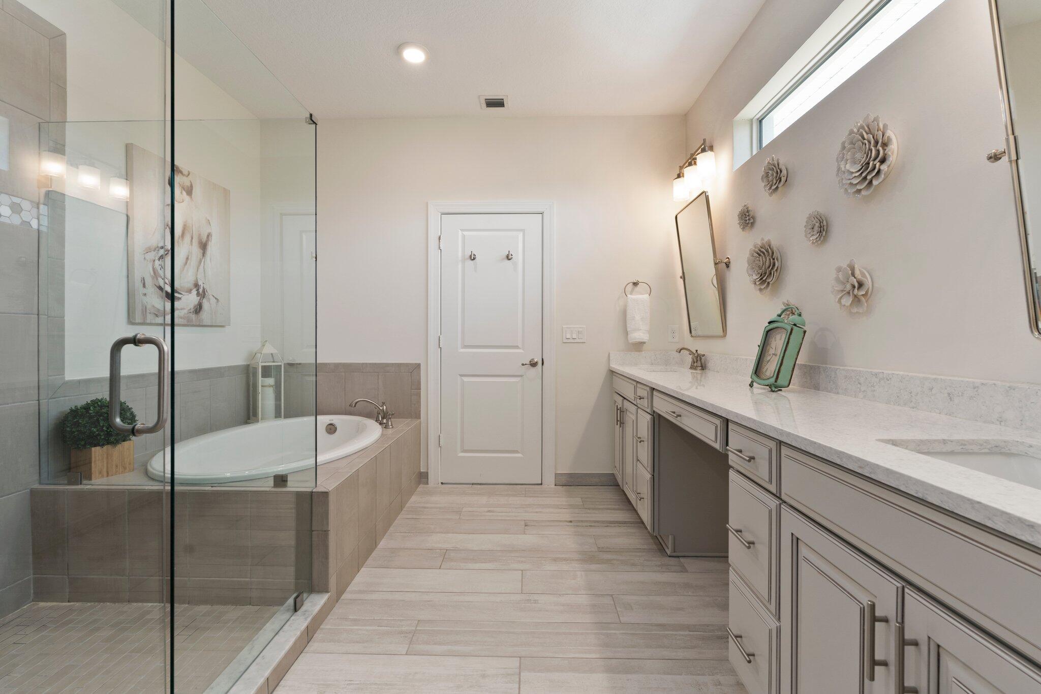 4701 Southwest Ardsley Drive Stuart, FL 34997 - Photo 38 of 83 a spacious bathroom with a tub sink and mirror