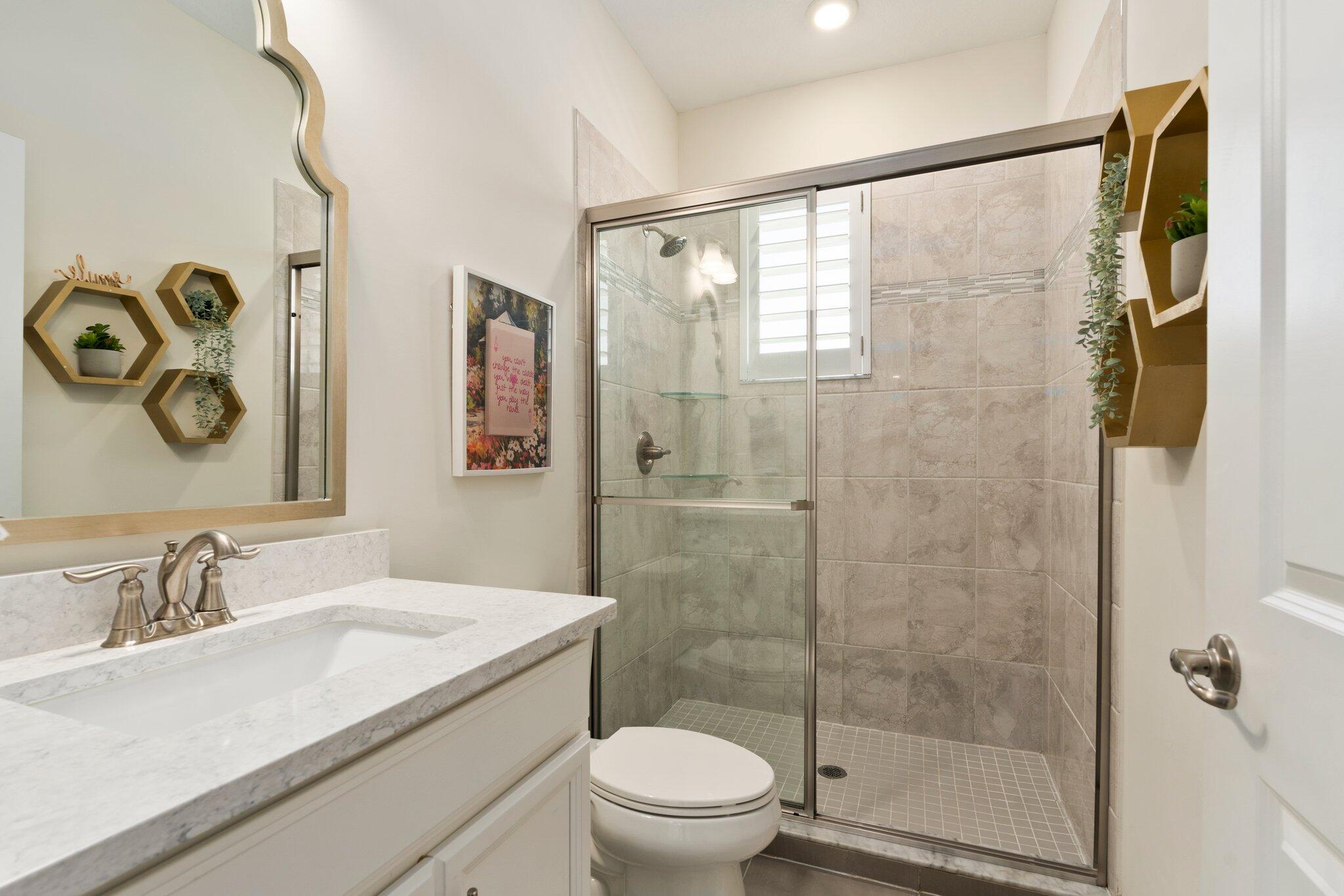 4701 Southwest Ardsley Drive Stuart, FL 34997 - Photo 46 of 83 a bathroom with a sink and a mirror