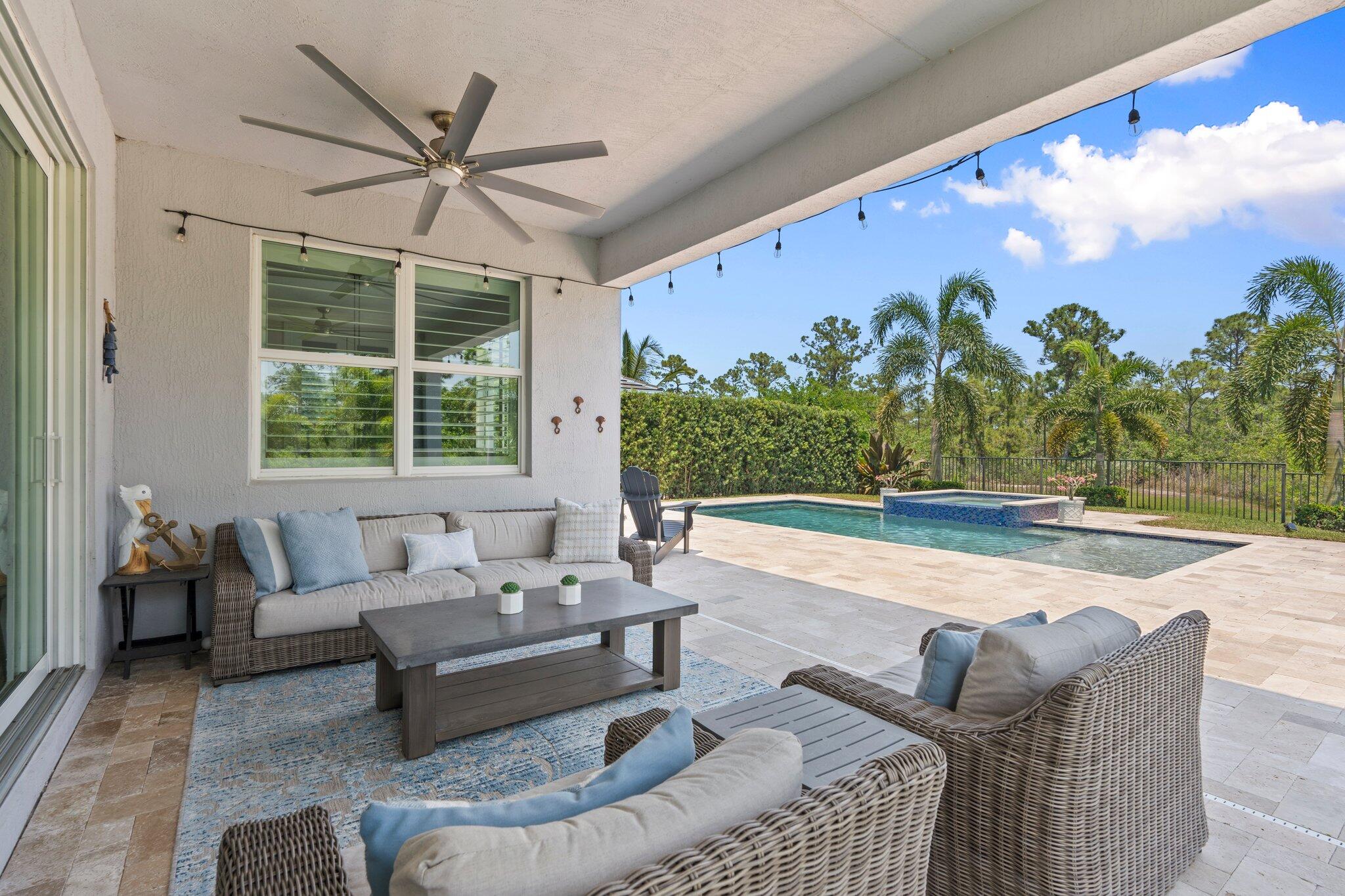 4701 Southwest Ardsley Drive Stuart, FL 34997 - Photo 48 of 83 a living room with furniture and a large window