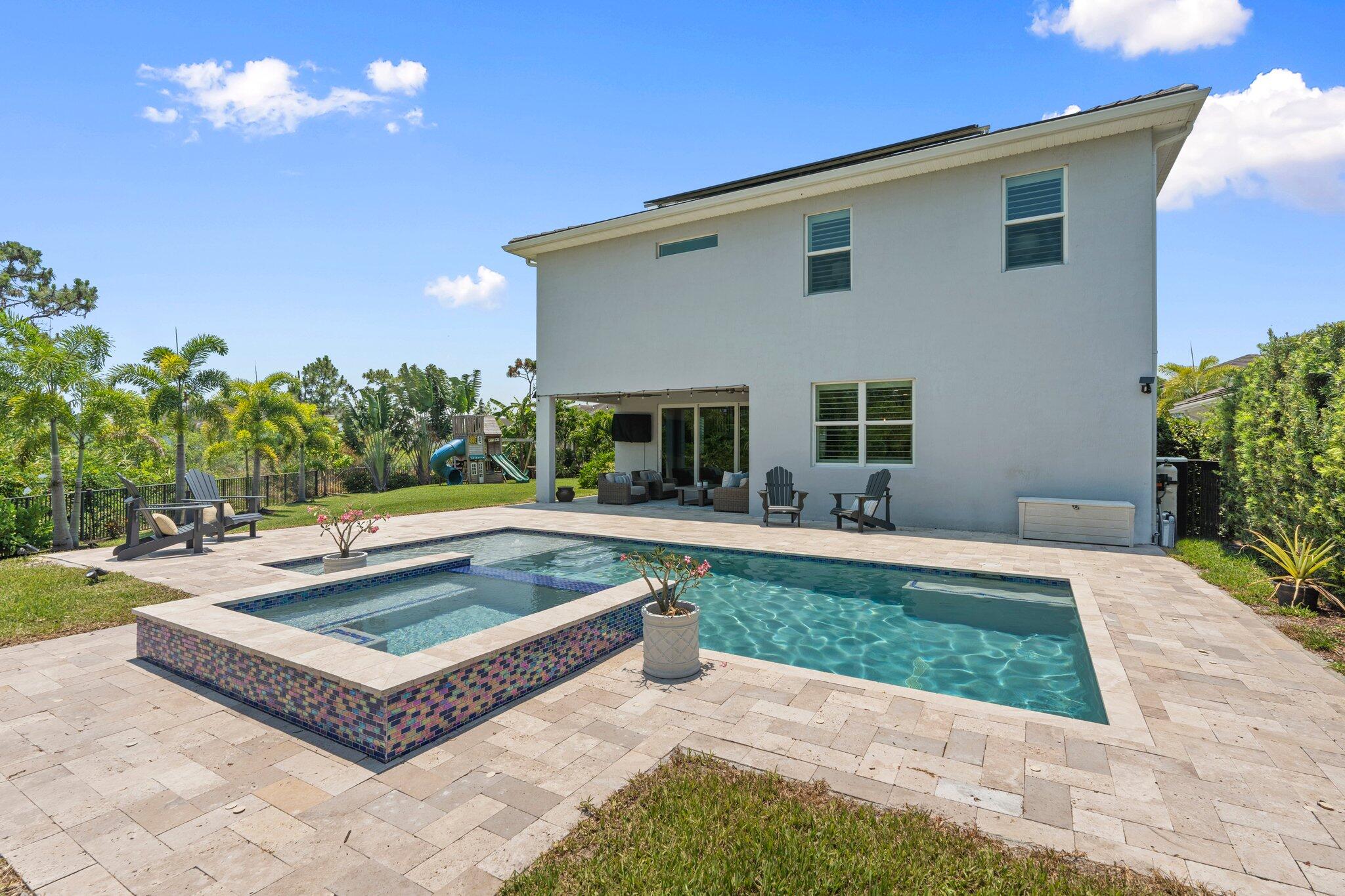 4701 Southwest Ardsley Drive Stuart, FL 34997 - Photo 52 of 83 a view of house with swimming pool outdoor seating