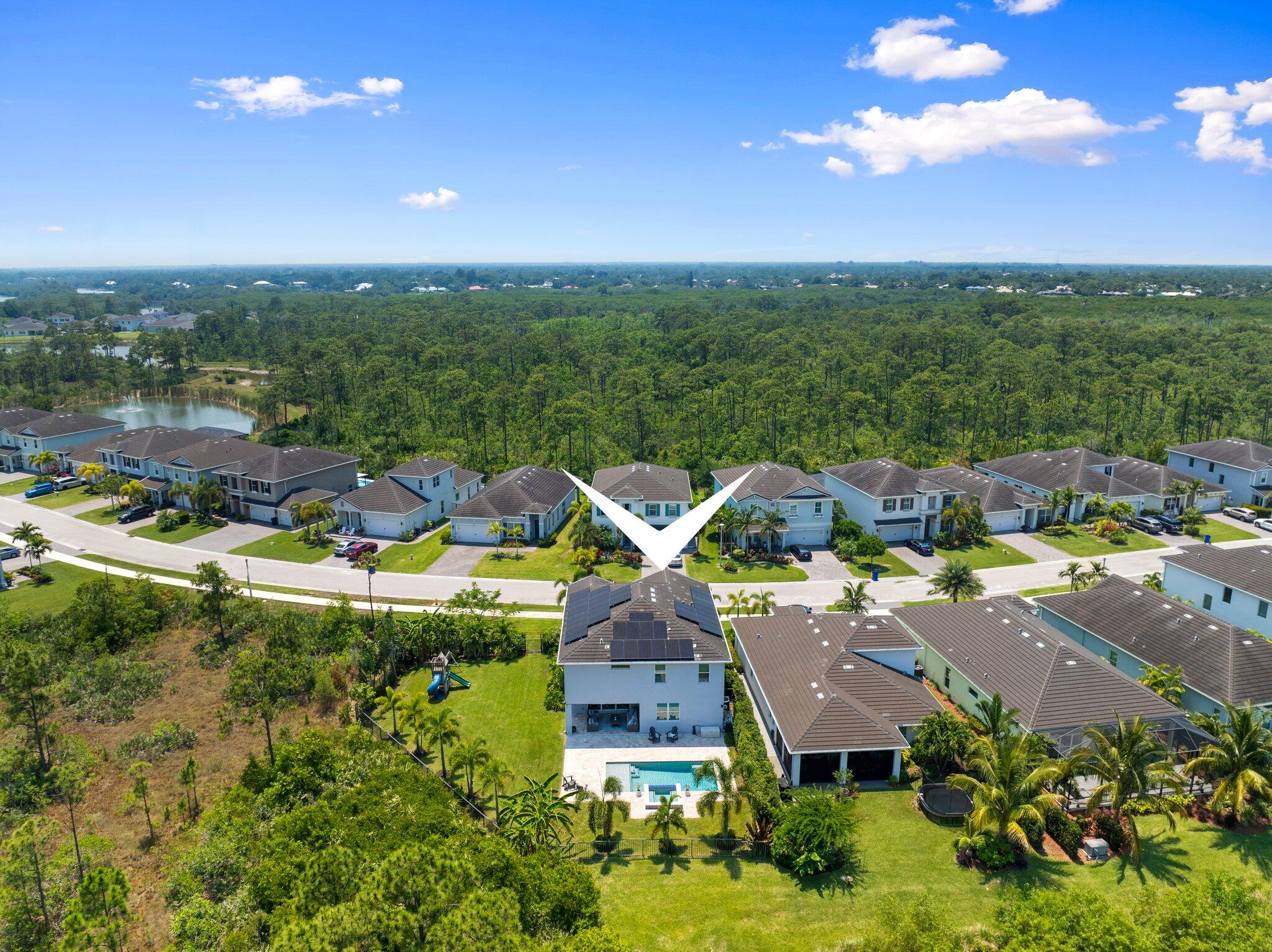 4701 Southwest Ardsley Drive Stuart, FL 34997 - Photo 59 of 83 an aerial view of a house with swimming pool and lake view