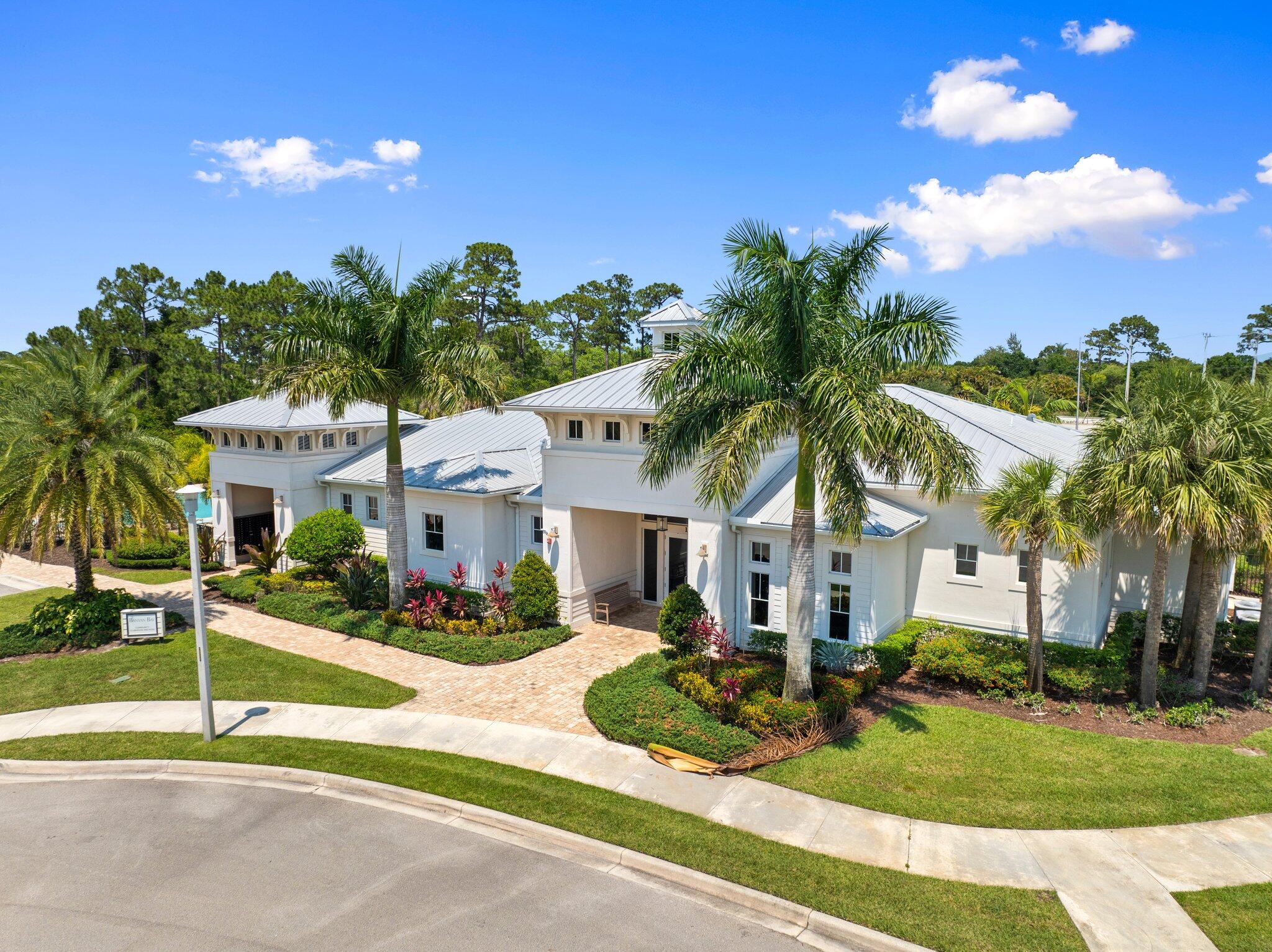 4701 Southwest Ardsley Drive Stuart, FL 34997 - Photo 65 of 83 a front view of house with yard and green space