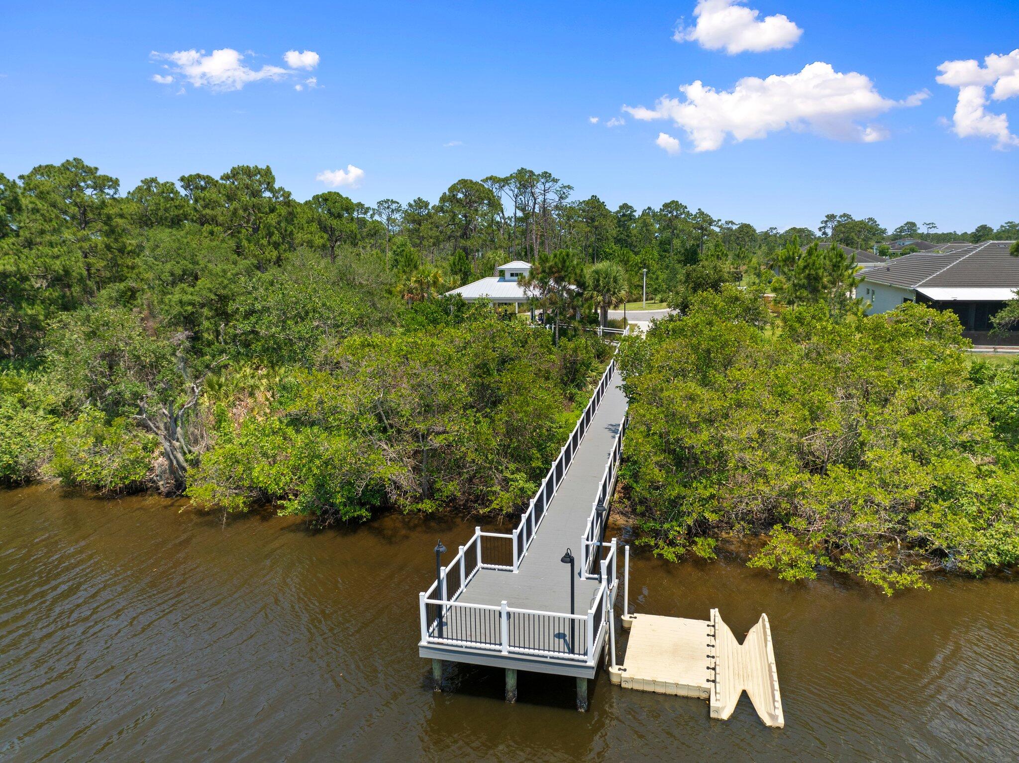 4701 Southwest Ardsley Drive Stuart, FL 34997 - Photo 70 of 83 a view of a ocean with a mountain in the background