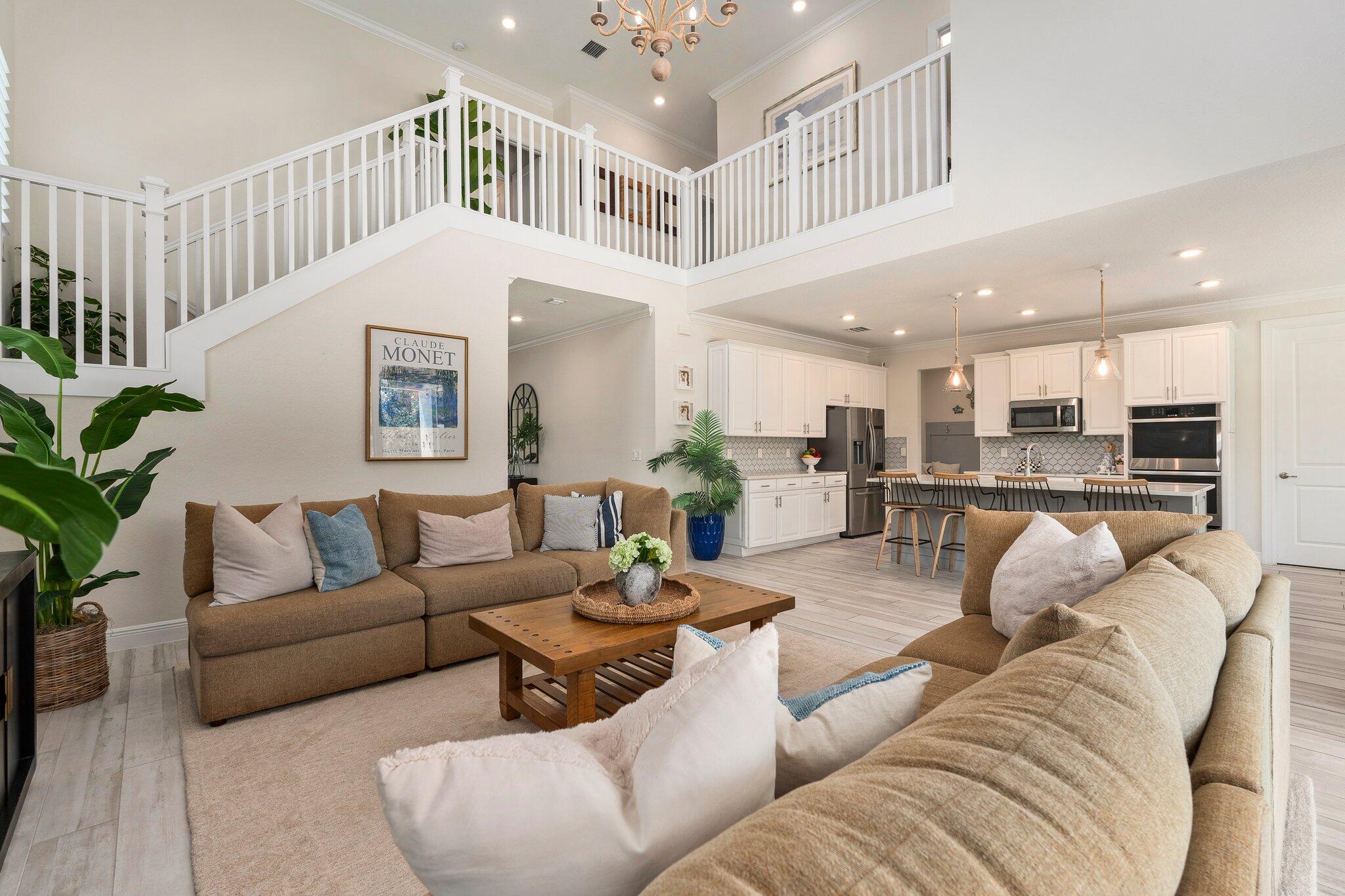4701 Southwest Ardsley Drive Stuart, FL 34997 - Photo 10 of 83 a living room with furniture kitchen view and a potted plant