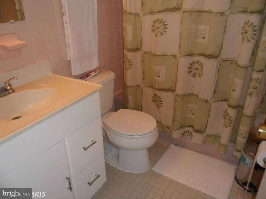 15200 Watergate Road Silver Spring, MD 20905 - Photo 11 of 22 a bathroom with a sink and toilet