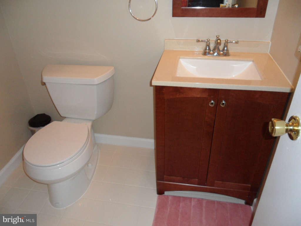 15200 Watergate Road Silver Spring, MD 20905 - Photo 18 of 22 a bathroom with a sink and a toilet