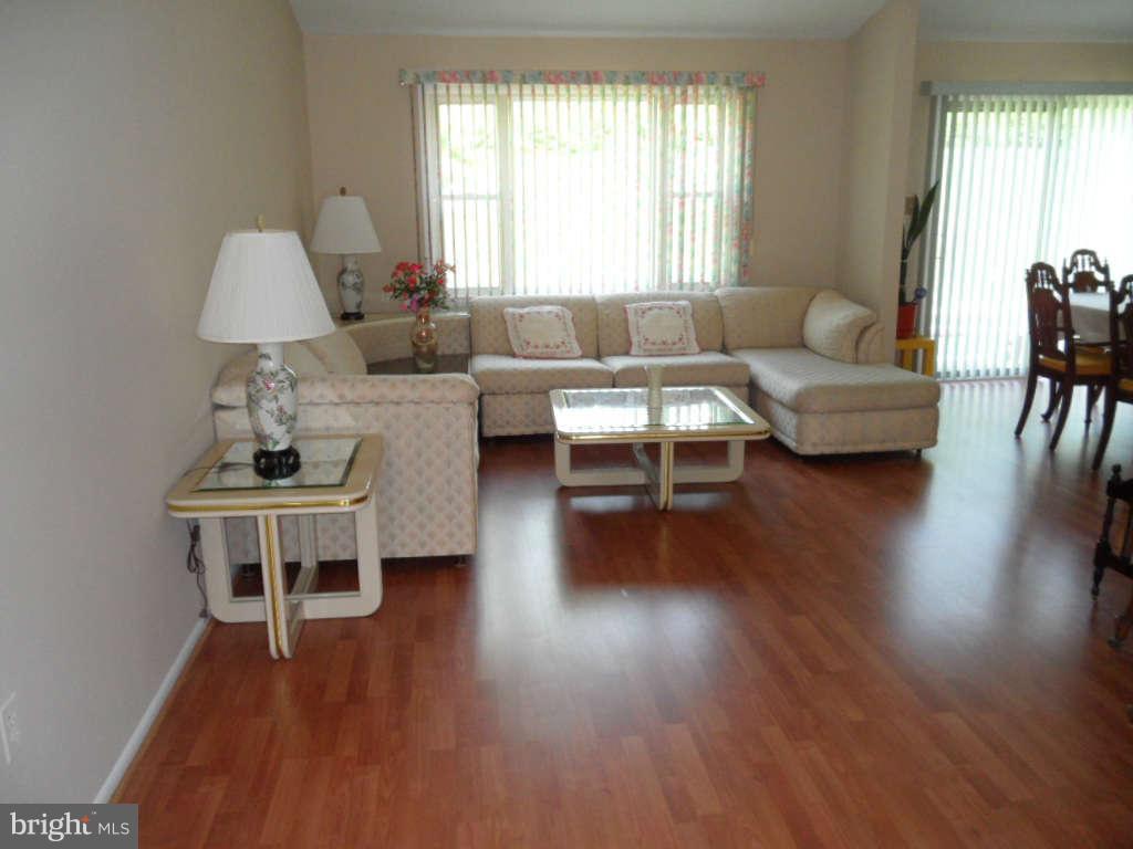 15200 Watergate Road Silver Spring, MD 20905 - Photo 8 of 22 a living room with furniture and a wooden floor