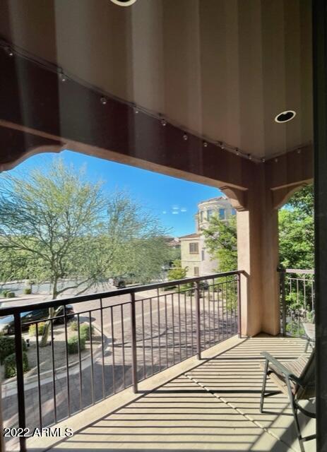 3935 East Rough Rider Road, Unit 1014 Phoenix, AZ 85050 - Photo 20 of 40 a view of a balcony with furniture