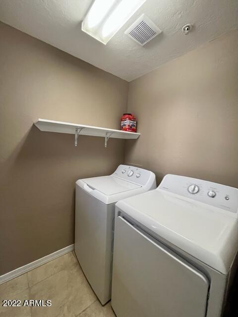 3935 East Rough Rider Road, Unit 1014 Phoenix, AZ 85050 - Photo 21 of 40 a utility room with dryer and washer