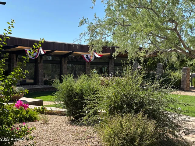 a backyard of a house with lots of green space and trees