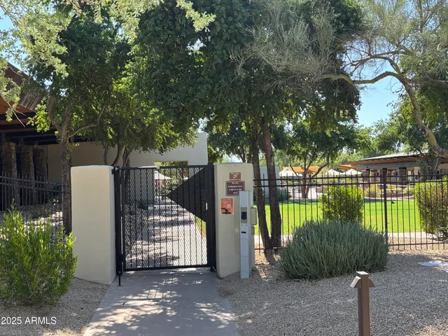 a view of a wrought iron fences in front of house