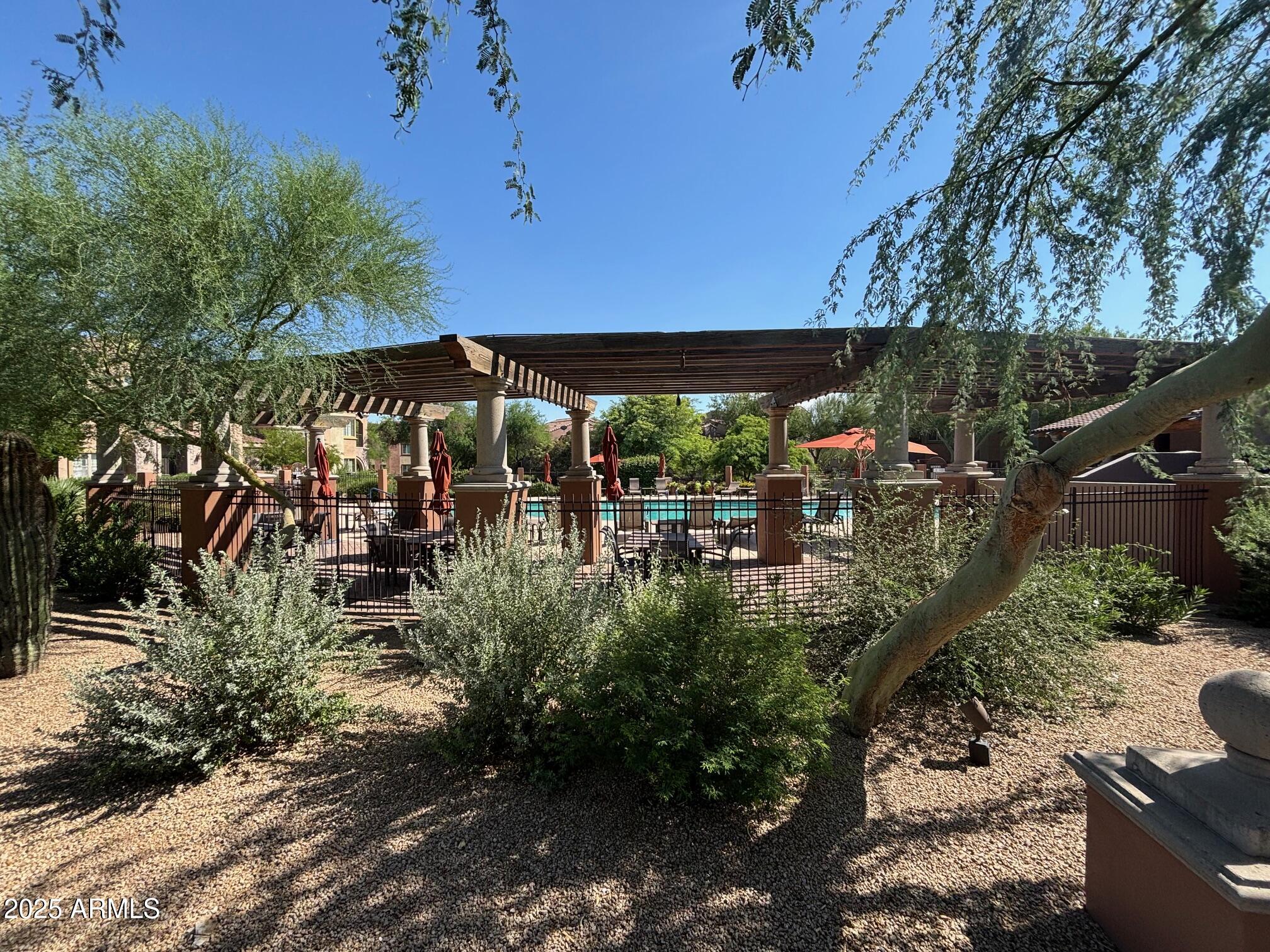 3935 East Rough Rider Road, Unit 1014 Phoenix, AZ 85050 - Photo 30 of 40 a view of outdoor space yard and patio