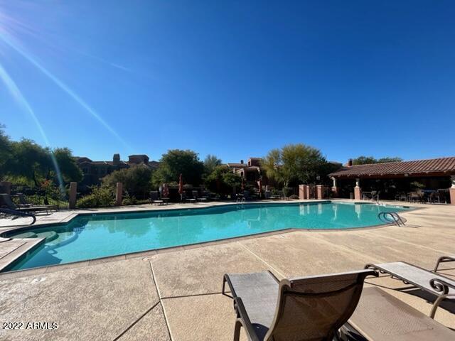 3935 East Rough Rider Road, Unit 1014 Phoenix, AZ 85050 - Photo 31 of 40 a view of a backyard