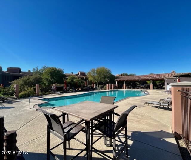 3935 East Rough Rider Road, Unit 1014 Phoenix, AZ 85050 - Photo 32 of 40 a view of swimming pool with seating space