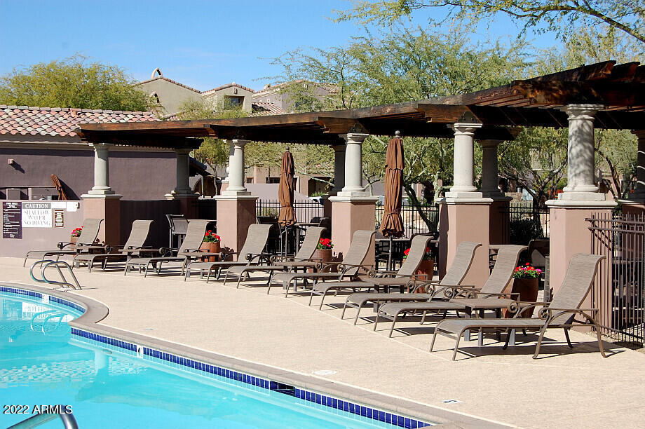 3935 East Rough Rider Road, Unit 1014 Phoenix, AZ 85050 - Photo 34 of 40 a view of a living room with gym equipment