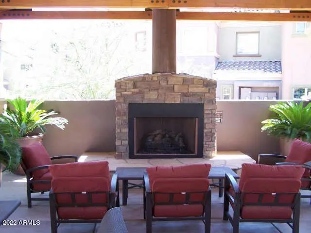 a living room with furniture a window and a fireplace