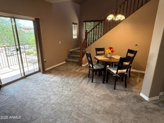 a view of a dining room with furniture window and outside view