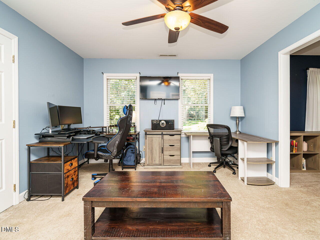 4104 Betterton Drive Raleigh, NC 27613 - Photo 17 of 32 a view of a workspace with furniture and a window