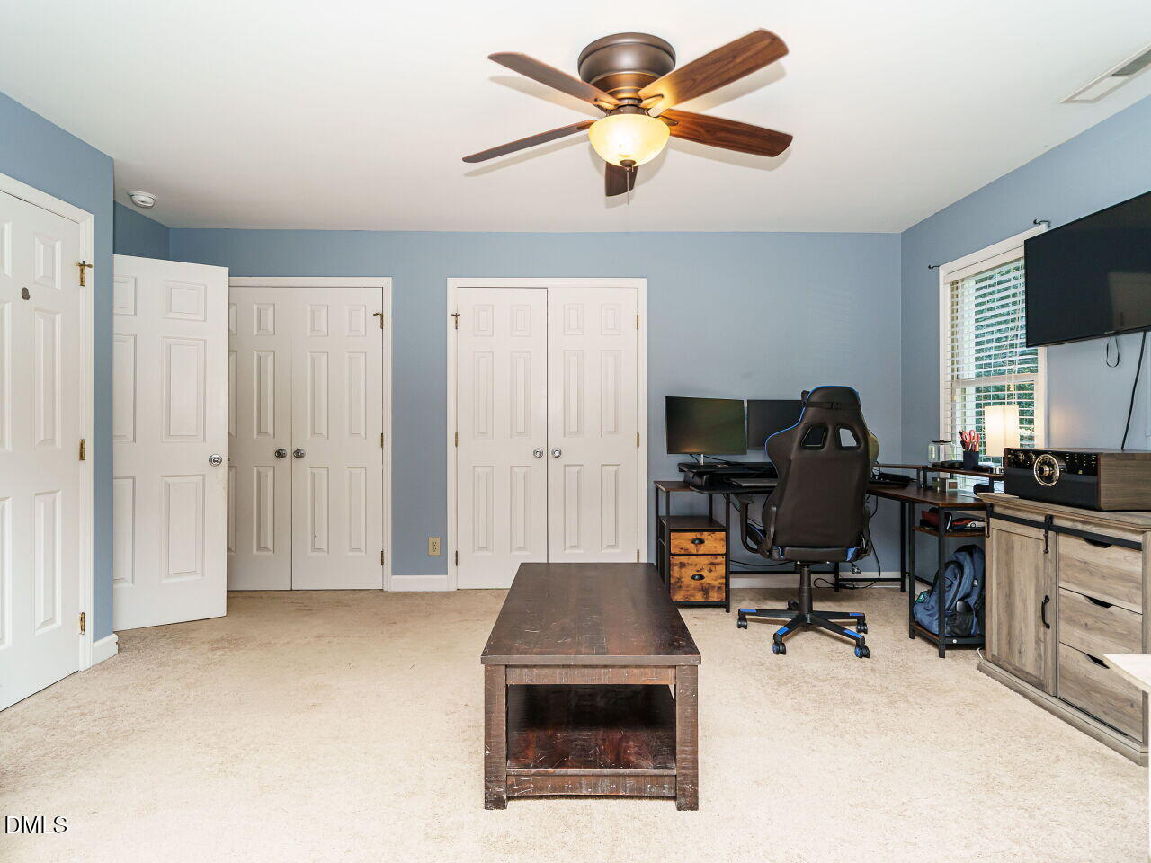 4104 Betterton Drive Raleigh, NC 27613 - Photo 18 of 32 a view of a workspace with furniture and a window