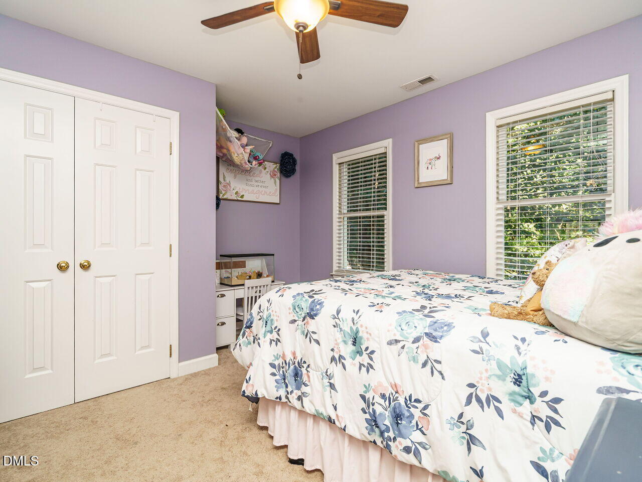 4104 Betterton Drive Raleigh, NC 27613 - Photo 20 of 32 a bedroom with a bed dresser and a window