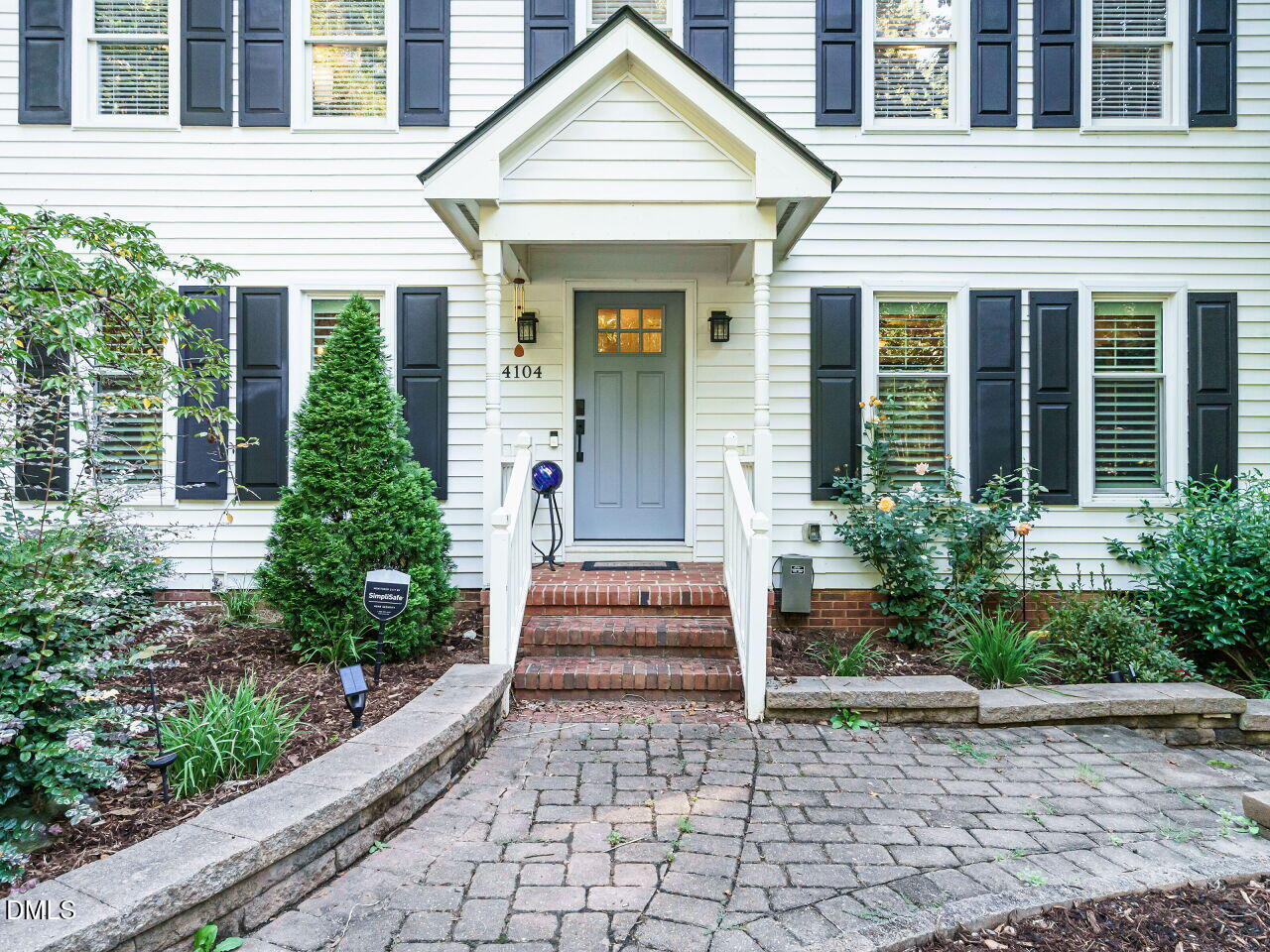 4104 Betterton Drive Raleigh, NC 27613 - Photo 2 of 32 a front view of a house with potted plants