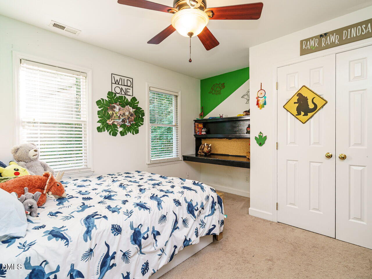 4104 Betterton Drive Raleigh, NC 27613 - Photo 22 of 32 a bedroom with a bed and a window