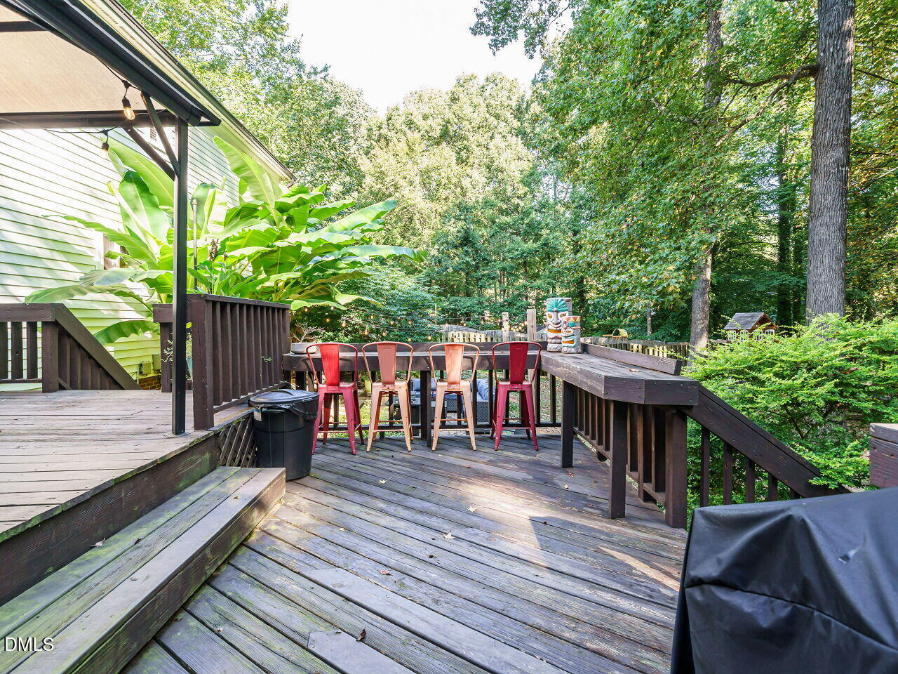 4104 Betterton Drive Raleigh, NC 27613 - Photo 25 of 32 a view of a deck with chairs and wooden floor