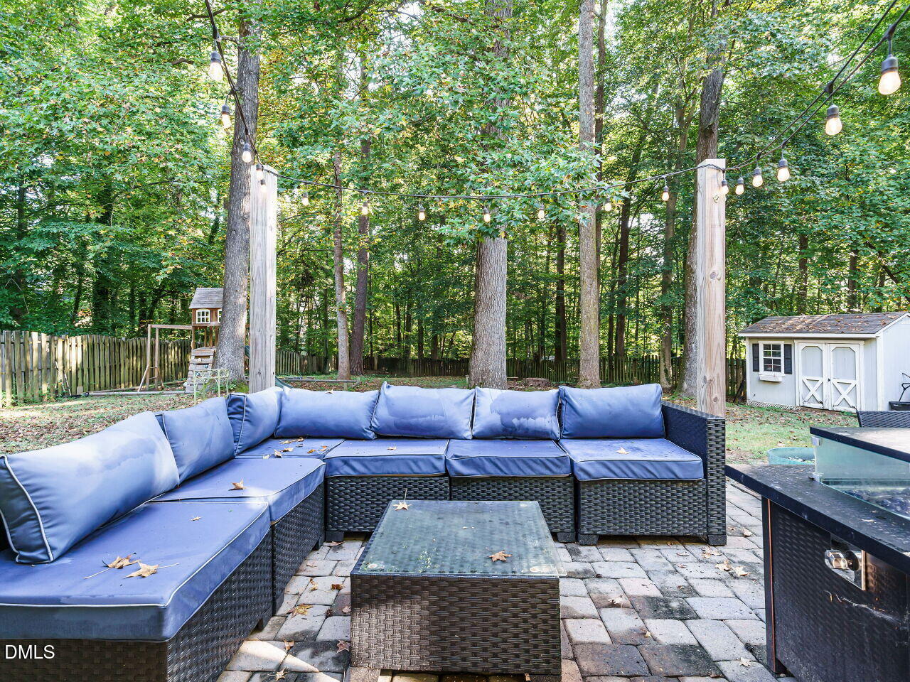 4104 Betterton Drive Raleigh, NC 27613 - Photo 27 of 32 a outdoor space with patio couch and a fire pit