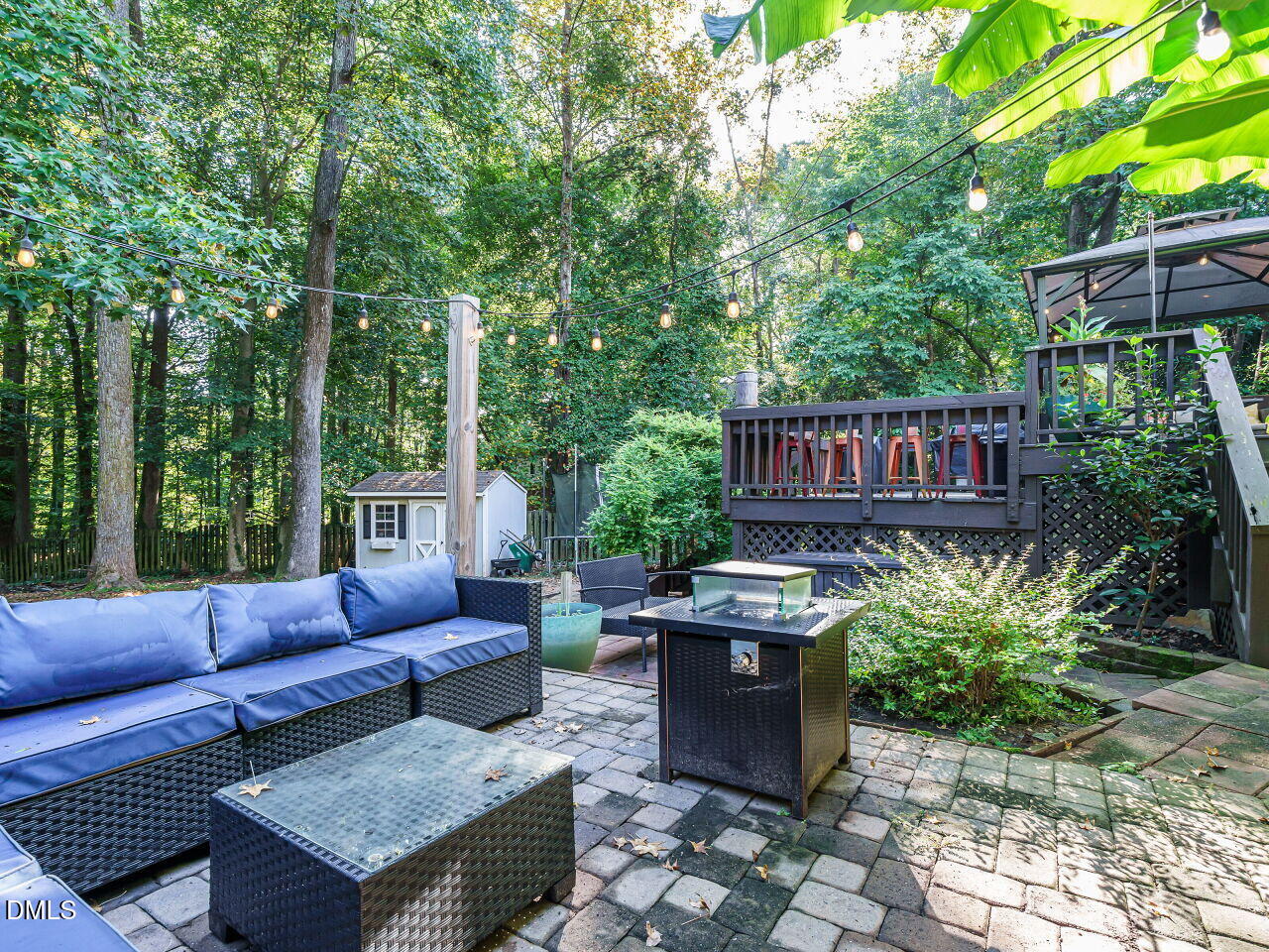 4104 Betterton Drive Raleigh, NC 27613 - Photo 28 of 32 a view of a patio with couches chairs and a fire pit