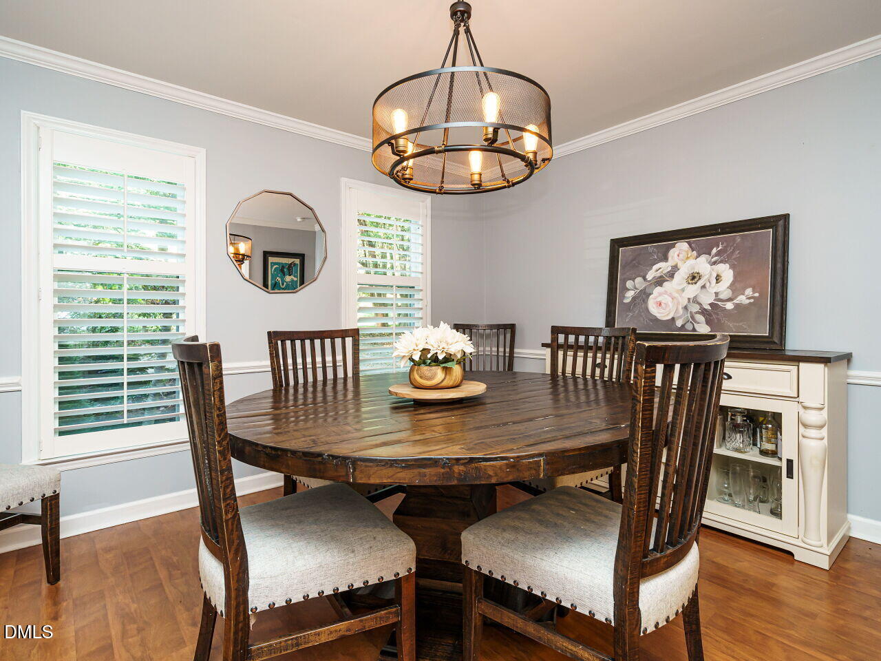 4104 Betterton Drive Raleigh, NC 27613 - Photo 8 of 32 a view of a dining room with furniture wooden floor and chandelier