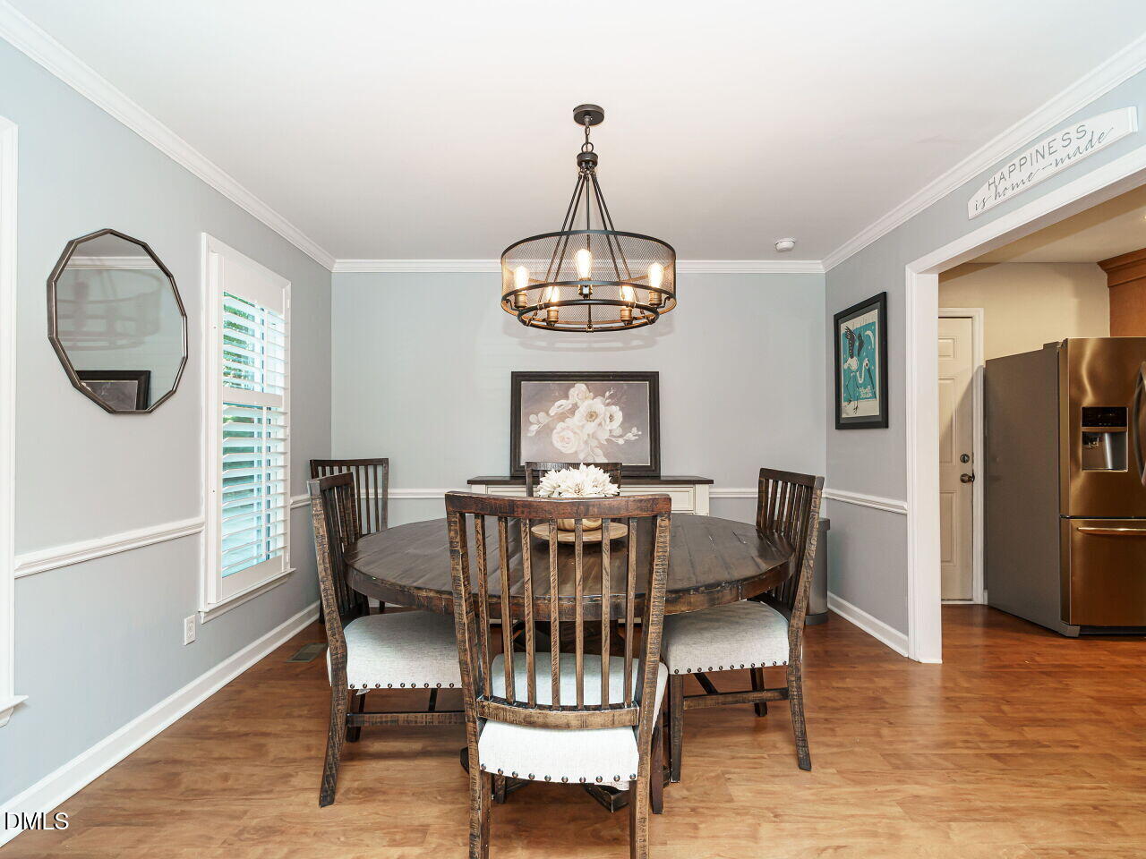 4104 Betterton Drive Raleigh, NC 27613 - Photo 9 of 32 a view of a dining room with furniture window and wooden floor