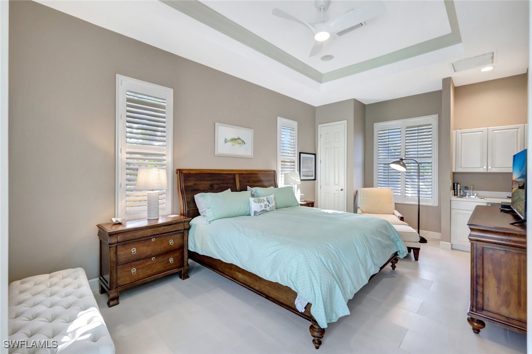 2450 Wulfert Road Sanibel, FL 33957 - Photo 32 of 44 a bedroom with a bed and a couch