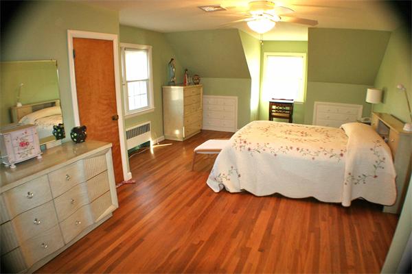 170 Anawan Road North Attleboro, MA 02760 - Photo 15 of 26 a bedroom with a bed and wooden floor