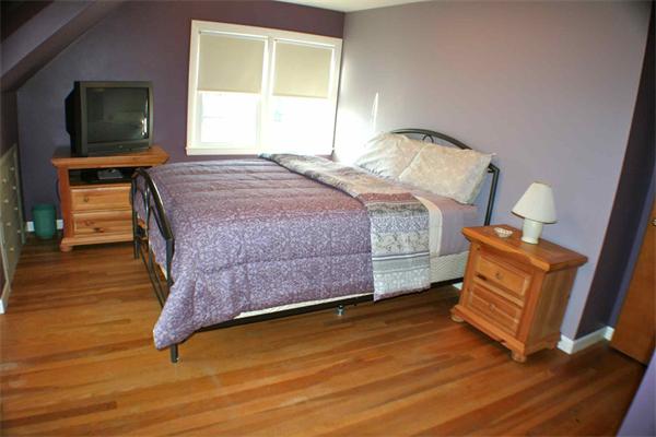 170 Anawan Road North Attleboro, MA 02760 - Photo 18 of 26 a bedroom with a bed and wooden floor