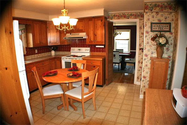 170 Anawan Road North Attleboro, MA 02760 - Photo 7 of 26 a dining room with chandelier and wooden floor