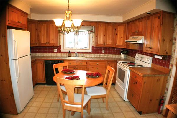 170 Anawan Road North Attleboro, MA 02760 - Photo 9 of 26 a dining room with a sink a refrigerator and a table