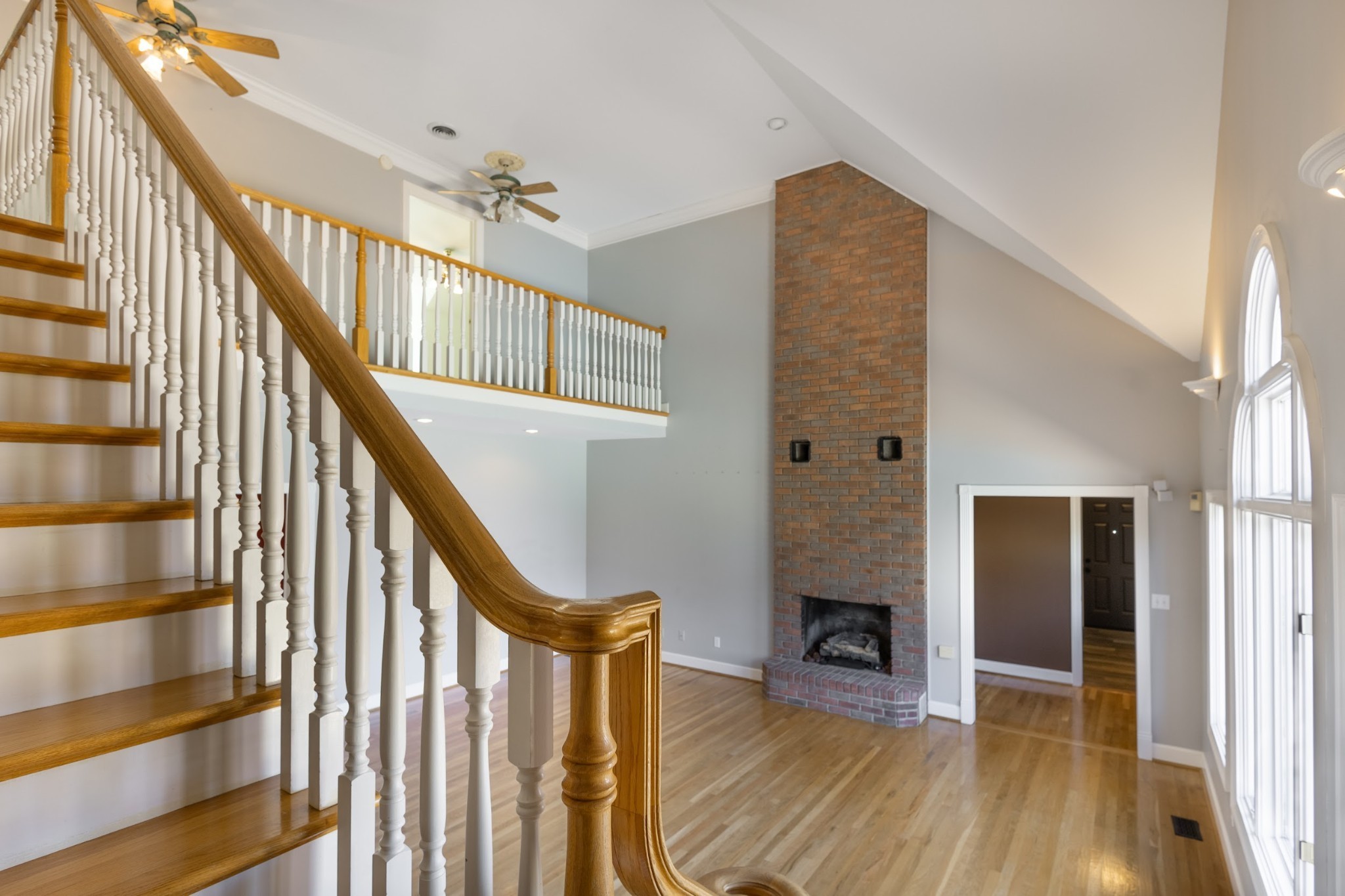 314 Fairview Road Dickson, TN 37055 - Photo 27 of 35 a view of a livingroom with wooden floor fireplace and staircase