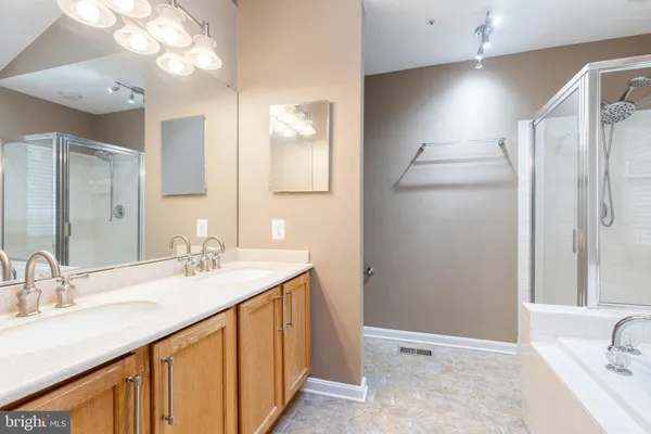 a bathroom with a sink double vanity and a mirror
