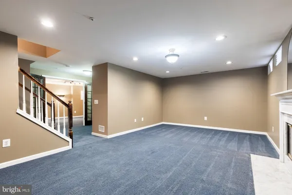 a view of an empty room with stairs