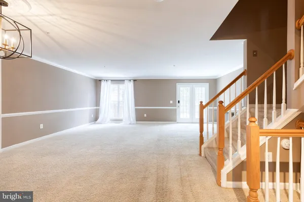 a view of an empty room with stairs