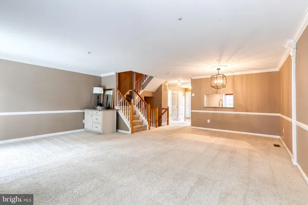 a view of a livingroom with a furniture and a ceiling fan