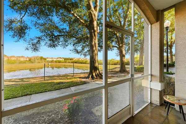 a view of a room with a floor to ceiling window and an outdoor view
