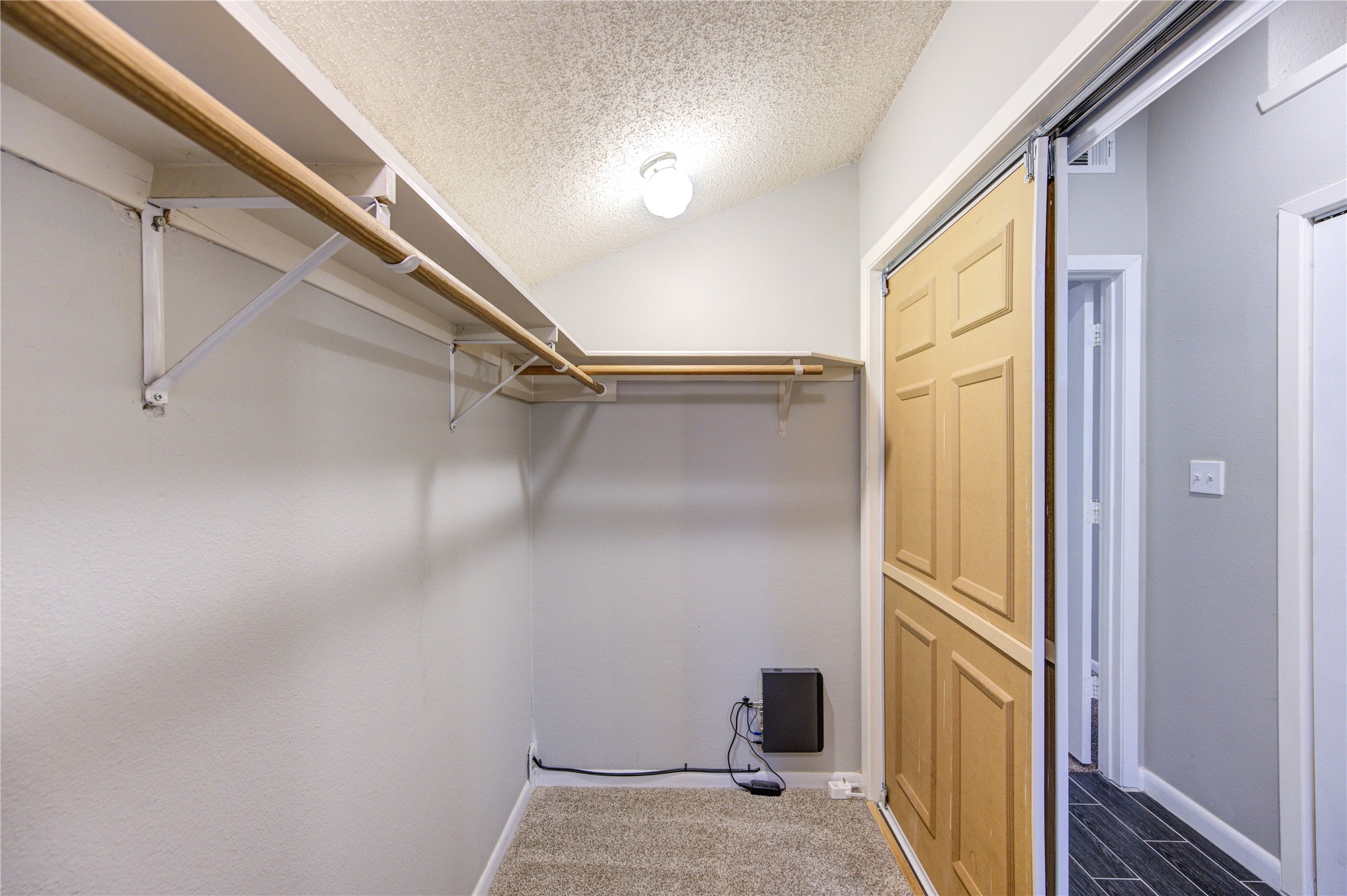 530 Enchanted Lane Spring, TX 77388 - Photo 23 of 26 a view of a room with rack on the wall and a window