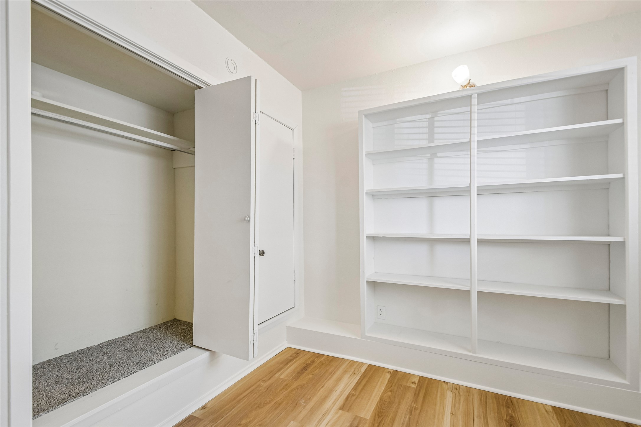 2413 Leon Street, Unit 104 Austin, TX 78705 - Photo 19 of 26 a view of an empty room with empty racks