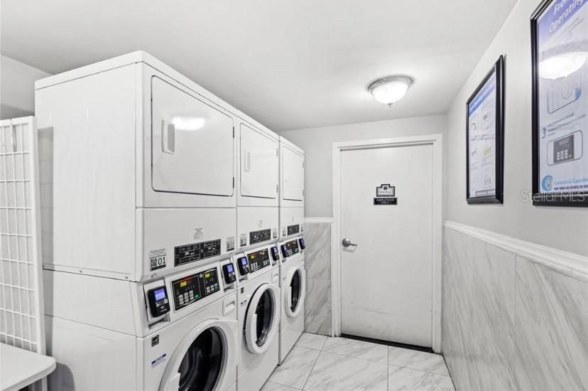 151 East Washington Street, Unit 611 Orlando, FL 32801 - Photo 17 of 21 a utility room with dryer and washer